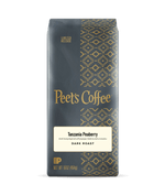 Peet's Coffee Tanzania Peaberry dark roast coffee package on a dark background