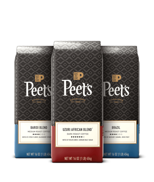 Three Peet's coffee bags with different blends on a black background