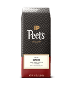Peet's coffee bag with dark pattern and red bottom on a green background