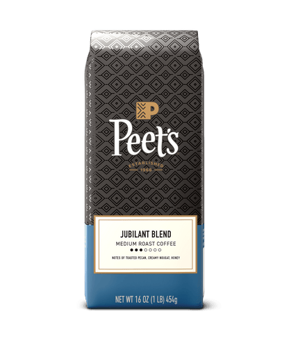 Peet's coffee Jubilant blend coffee bag with black and blue design on a green background